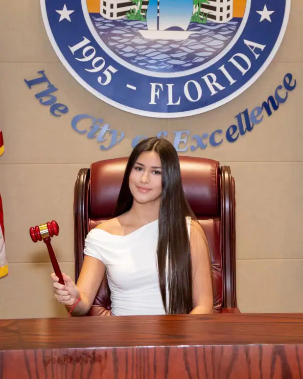 The gavel passes to a student.